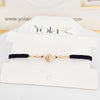 Pulsera tejida San Benito  oro laminado
