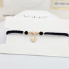Pulsera tejida San Benito  oro laminado
